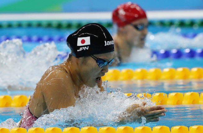 The Latest: Phelps routs rival Lochte for 22nd Olympic gold