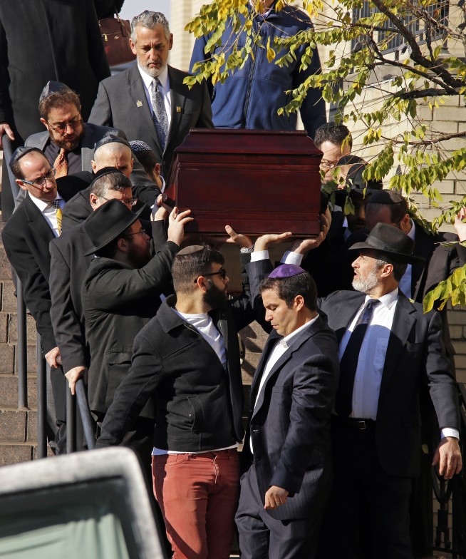 Synagogue rampage suspect indicted as funerals continue