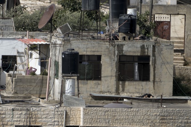 Israeli soldiers pushed 4 apparently lifeless bodies from roofs during a West Bank raid