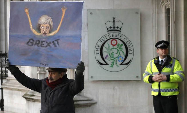 The Latest: UK can't trigger Brexit without Parliament