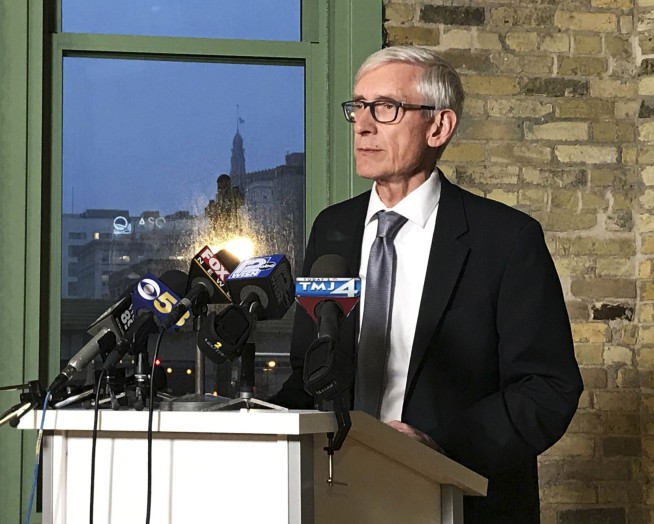 Wisconsin's Walker signs sweeping lame-duck GOP bills