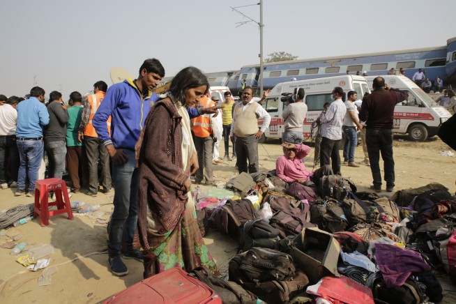 Train derails in north India, killing 104; many trapped