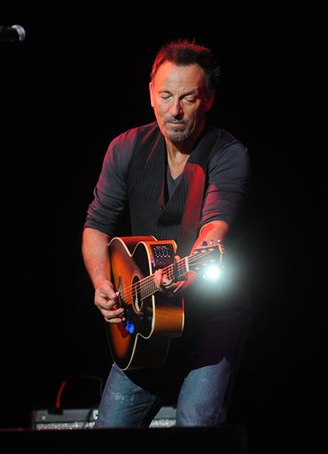 Springsteen auctions guitars, lasagna for veterans