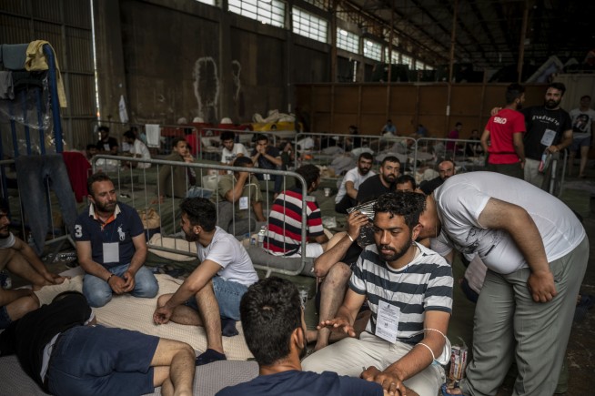 Hope dims for missing migrants amid questions about Greece's actions in deadly sinking