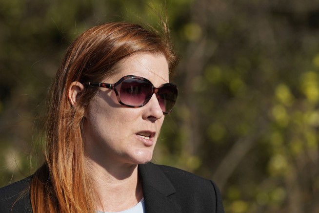 Woman charged in threats against Michigan election official