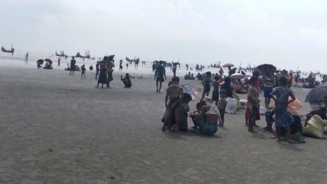 The Latest: Photos show Rohingya stranded on Myanmar beach