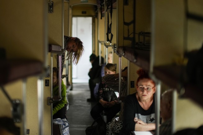 Russia takes small cities, aims to widen east Ukraine battle