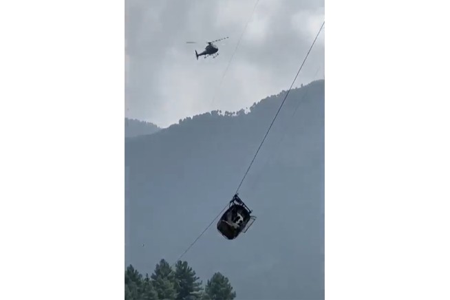Rescuers save 8 people trapped in cable car dangling above canyon in Pakistan