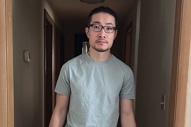 Chinese national who exposed rights abuses is freed from US detention after being granted asylum