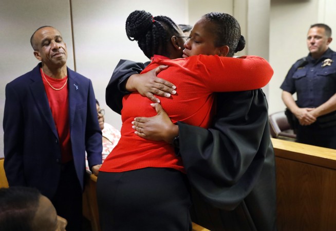 Judge’s hug not embraced by all after Dallas officer’s trial