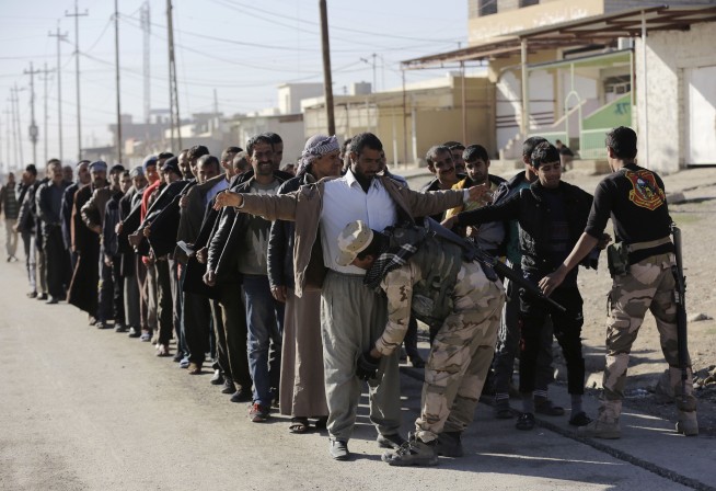 Iraqis advance in Mosul as bomb south of Baghdad kills 21