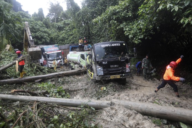 Landslide triggered by rain in Indonesia's Sumatra island kills 9 people in a tourist bus