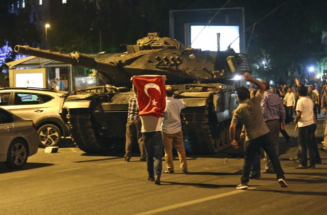 The Latest: Report: Helicopter with coup plotters downed