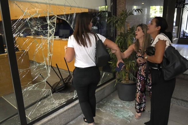 Woman with toy gun grabs trapped savings from Beirut bank