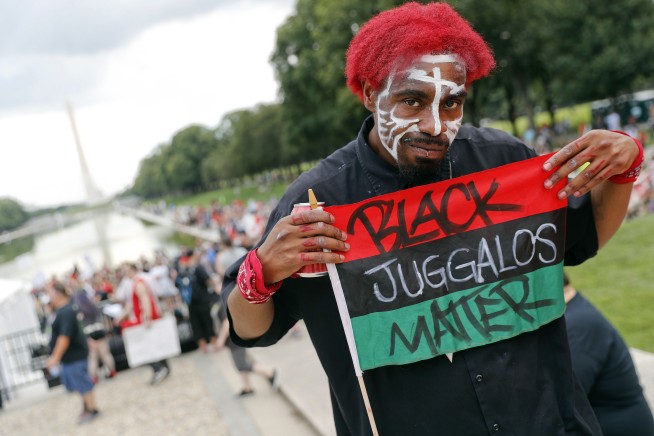 The Latest: Fans of the band Insane Clown Posse stage rally