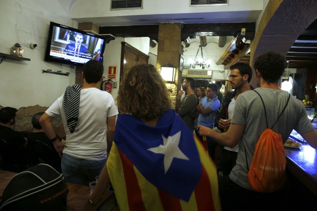 Catalans stop work to protest police force during referendum
