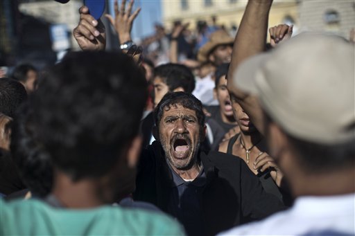 The Latest: EU hopes to redistribute 120,000 migrants