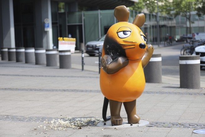 Vandals set fire to a mouse statue that's a TV star and mascot for a German broadcaster