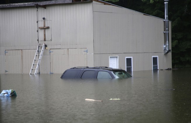 Vermont hit by 2nd day of floods as muddy water reaches the tops of parking meters in capital city