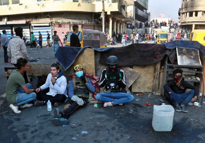 Officials: Iraq protesters burn down Iran consulate in Najaf