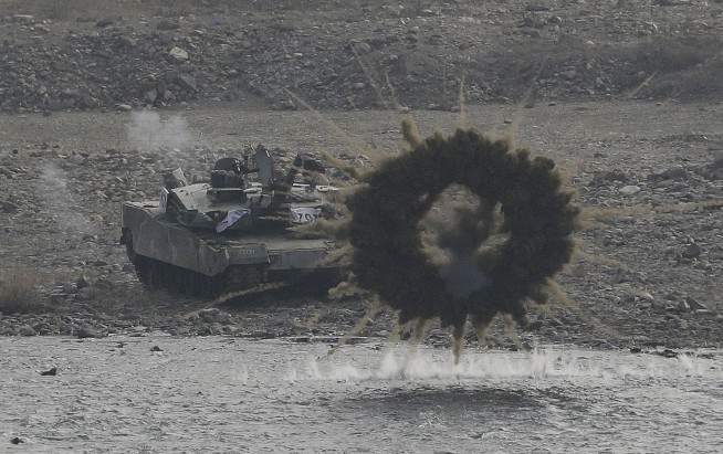 N. Korea, on defense after sanctions, makes nuclear threat