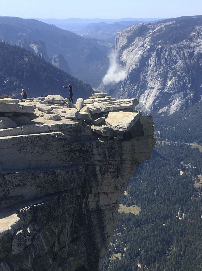 The Latest: Yosemite exit route closed after second slide