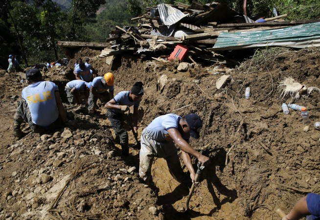 Hope fades in Philippines for dozens trapped in landslides