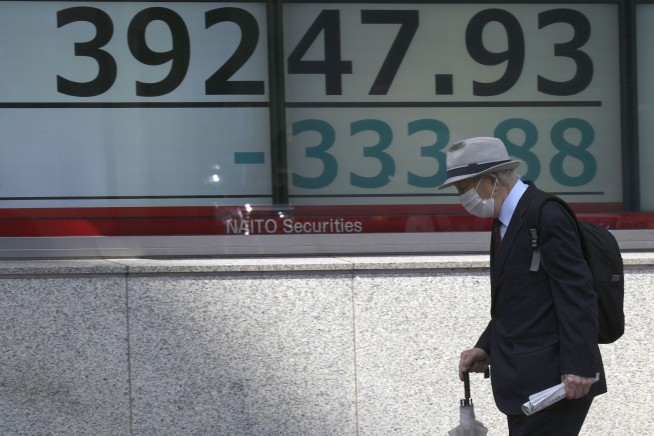Stock market today: Asian shares are mixed, taking hot US inflation data in stride