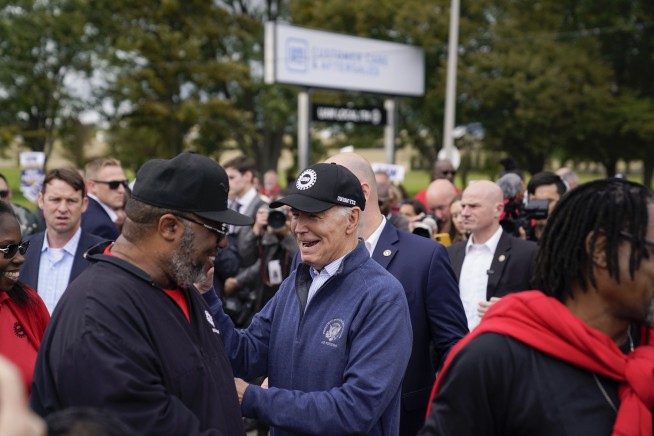 Biden urges striking auto workers to 'stick with it' in picket line visit unparalleled in history