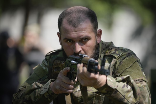 Ukraine's divisive mobilization law comes into force as a new Russian push strains front-line troops
