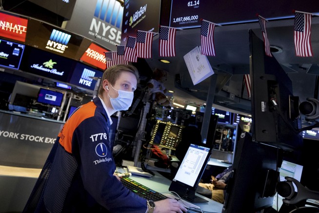 Stocks end another up-and-down day with mixed results