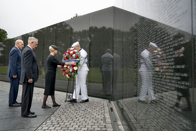 McCain tributes echo with criticism of Trump