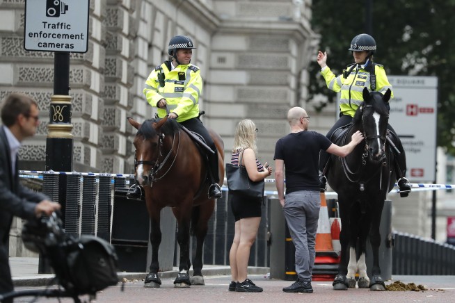 The Latest: UK police say properties raided after car crash