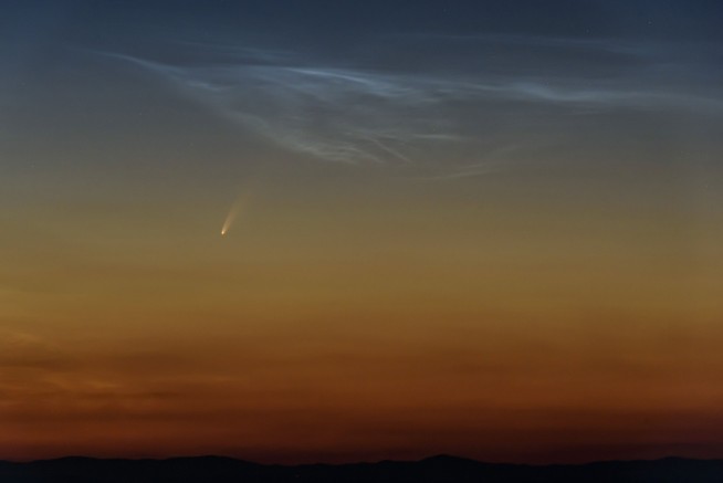 Comet streaking past Earth, providing spectacular show