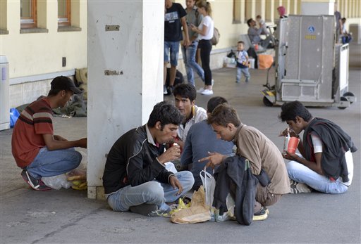 The Latest: Greek ferries carry 4,000 migrants to mainland