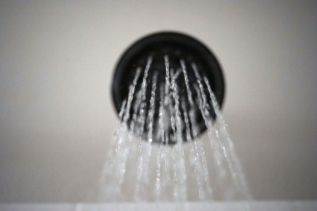 Rules eased for water from showerheads, a Trump pet peeve
