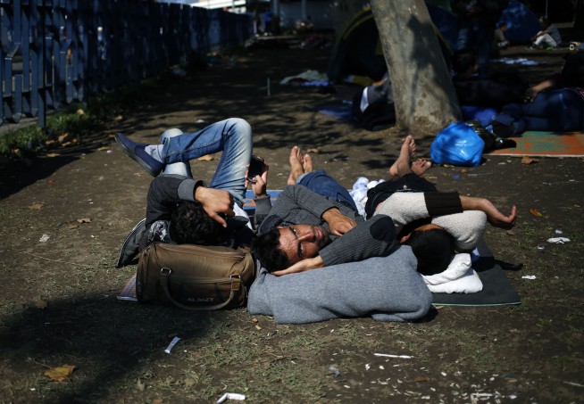 The Latest: 10 migrants drown at sea off Greece