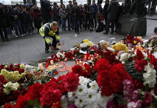 The Latest: Deeply shaken Russians mourn plane crash victims