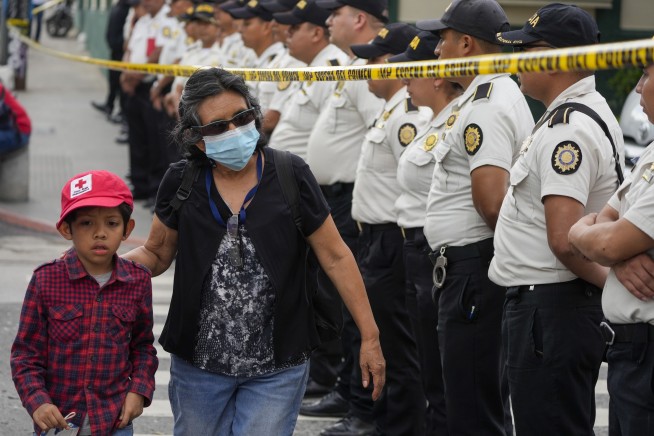 Police scuffle with electoral court justices in Guatemala as prosecutors seek to seize vote tallies