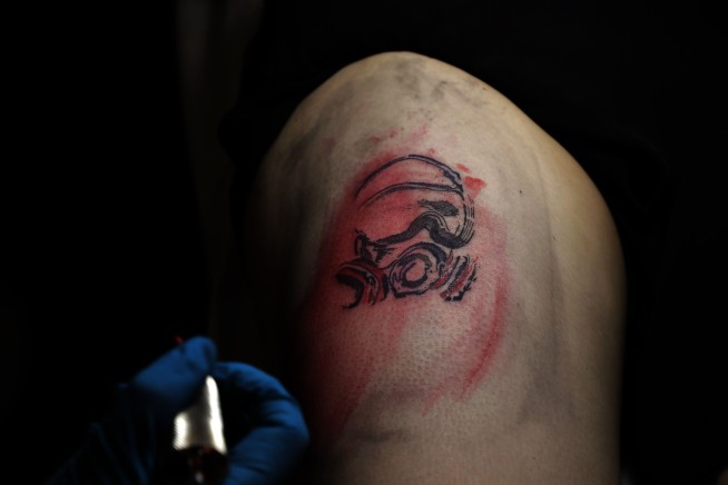 Hong Kong protesters use skin and ink to support movement
