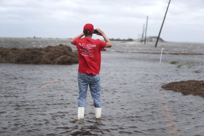 Dorian's floodwaters trap people in attics in North Carolina