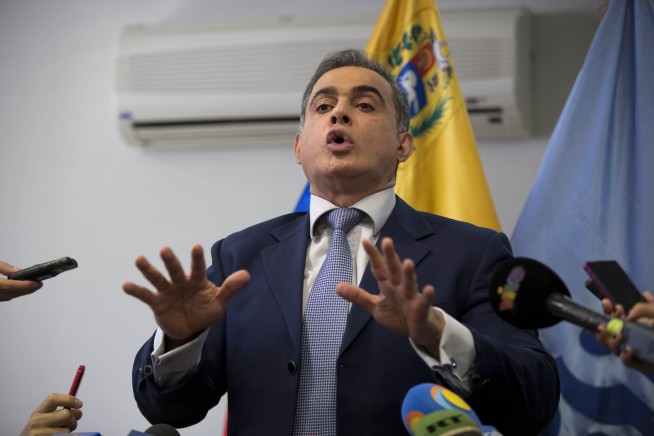 Venezuela leader's foes levy new sanctions and fresh strike