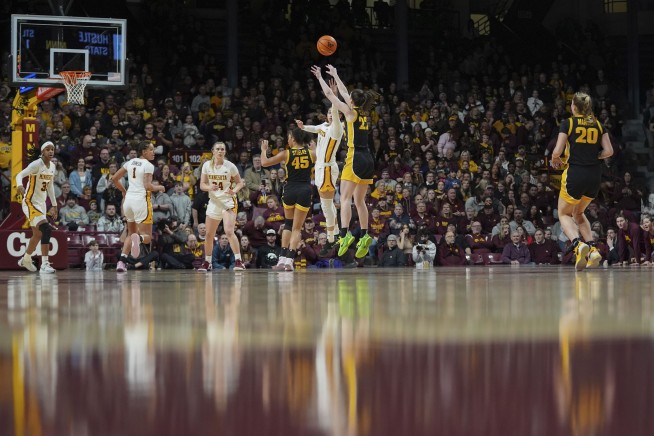 Caitlin Clark's 33-point game moves her past Lynette Woodard for the major college scoring record
