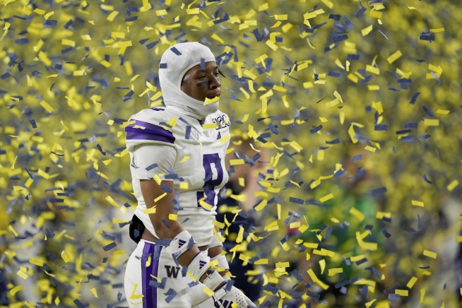 Michigan overpowers Washington 34-13 as Jim Harbaugh delivers a national title