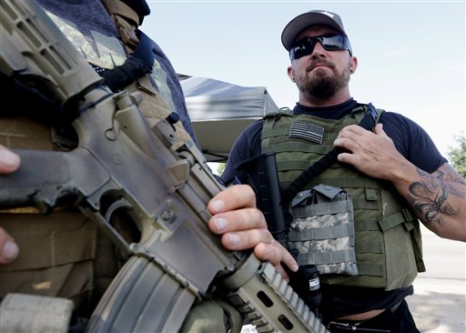 After Tennessee shootings, armed citizens guard recruiters