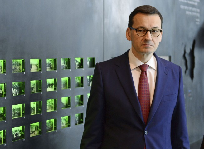 The Latest: Party head: Israel confirms Polish view on Nazis