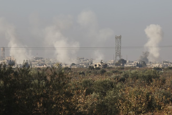 Syrian insurgents capture four central towns as government forces reclaim some territory