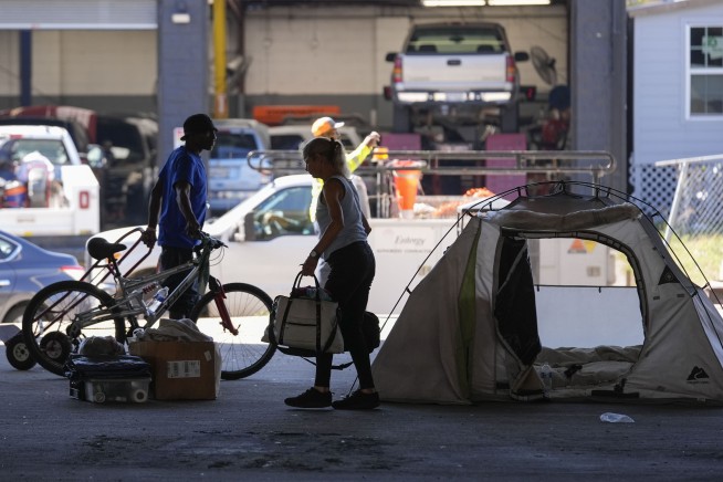 Before Taylor Swift show in New Orleans, a homeless encampment is forced to move