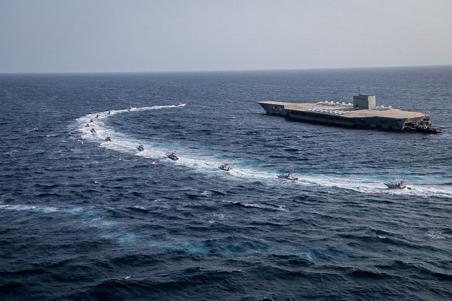 Iran missiles target fake carrier as US bases go on alert