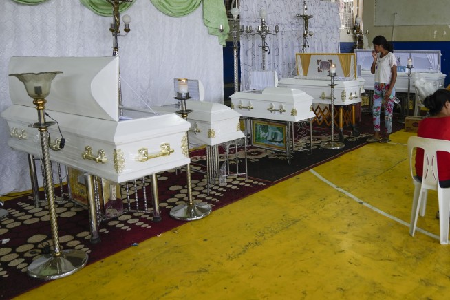 At least 126 dead and missing in massive flooding and landslides in Philippines